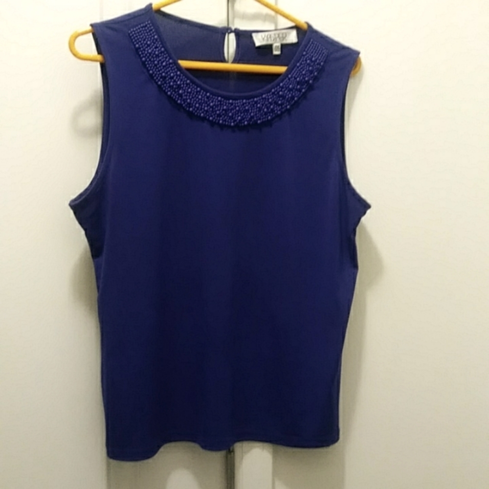 Cute shell top with jems across the neckline
